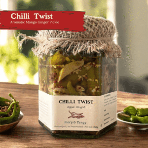 Glass jar of Chilli Twist Pickled Green Chilli on a wooden surface with green chillies and garlic